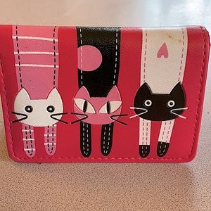 Wallet with novelty kitty cats on it. Excellent pre owned condition.